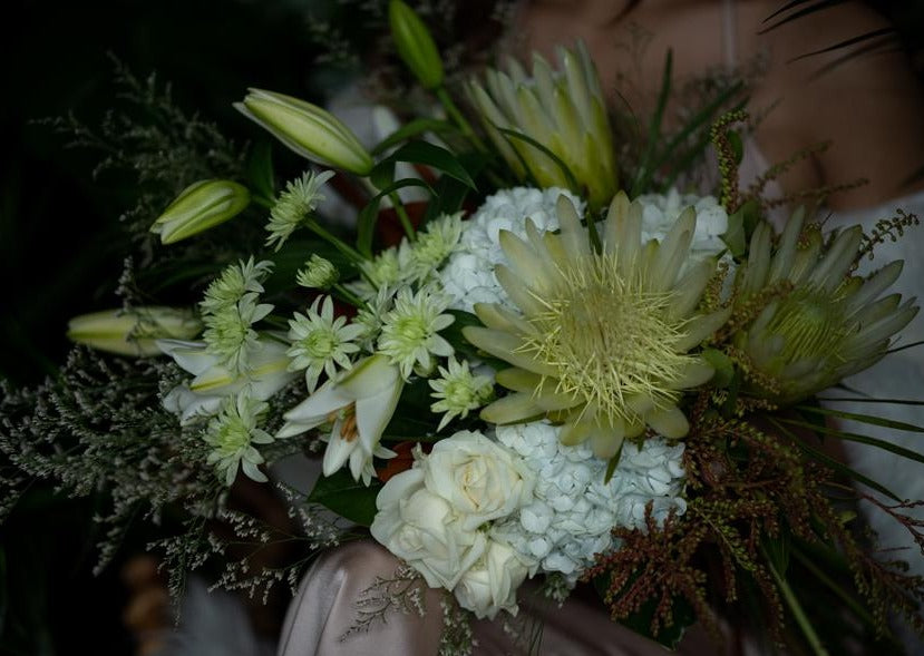 Model with Classic White "Unconditional Love" bouquet - Close up of bouquet