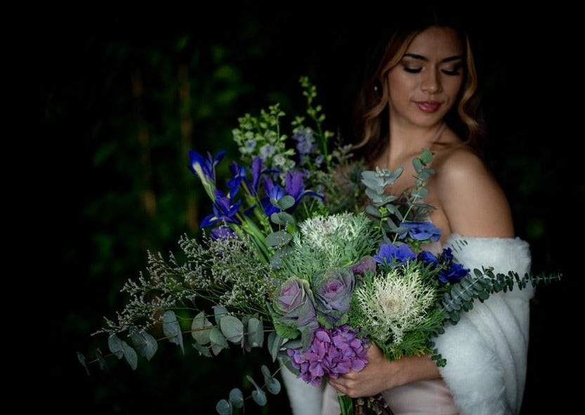 Model with Blue "Unconditional Love" bouquet
