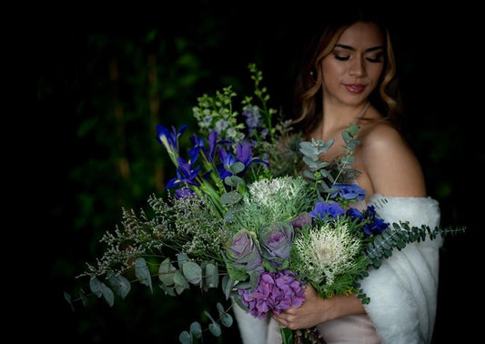 Model with Blue "Unconditional Love" bouquet