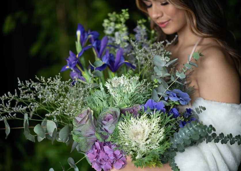 Model with Blue "Unconditional Love" bouquet