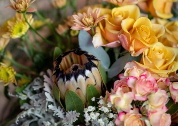 Model with Honey Orange "Unconditional Love" bouquet - Close up.