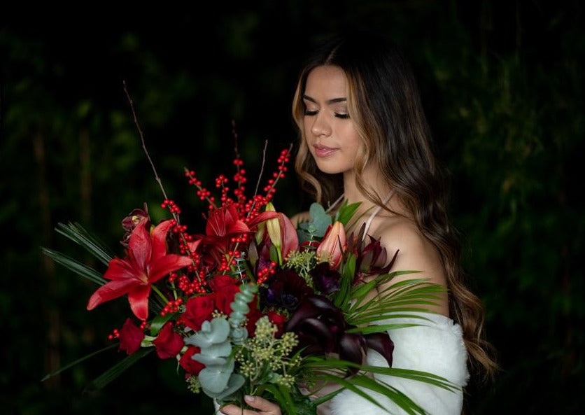 Model with Red "Unconditional Love" bouquet