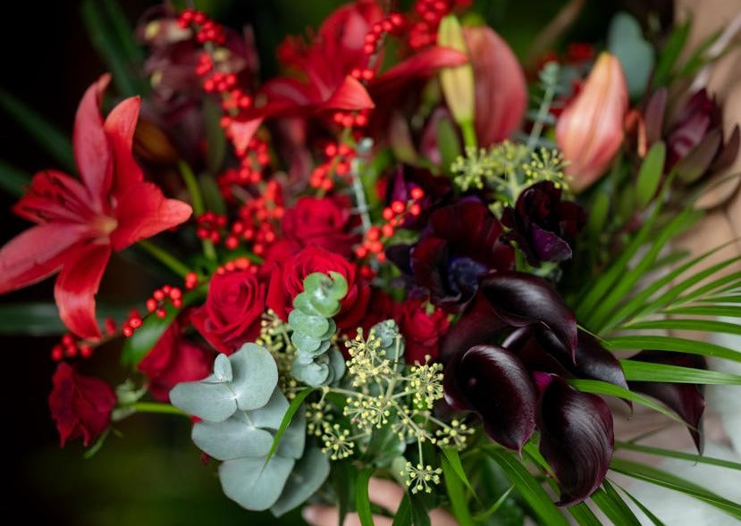 Model with Red "Unconditional Love" bouquet - Close up of bouquet