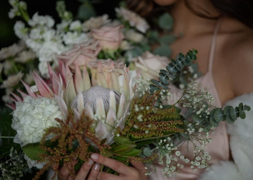 Model with Blush Pink "Unconditional Love" bouquet - Close up of bouquet