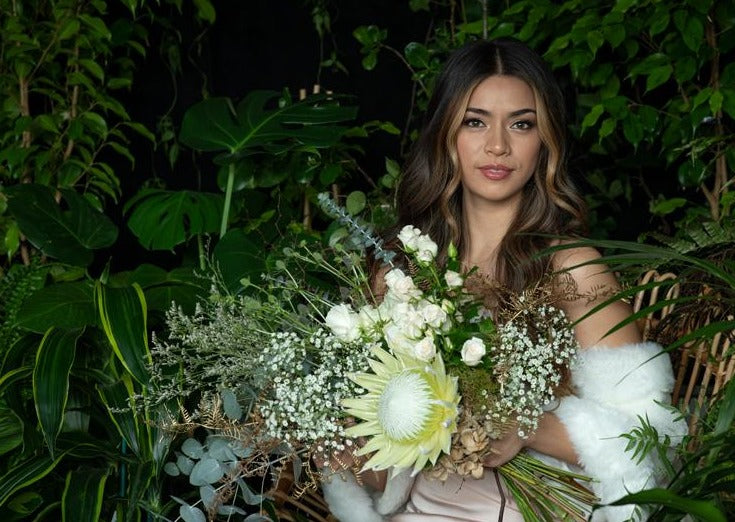 Model with Vintage White "Unconditional Love" bouquet
