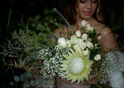 Model with Vintage White "Unconditional Love" bouquet