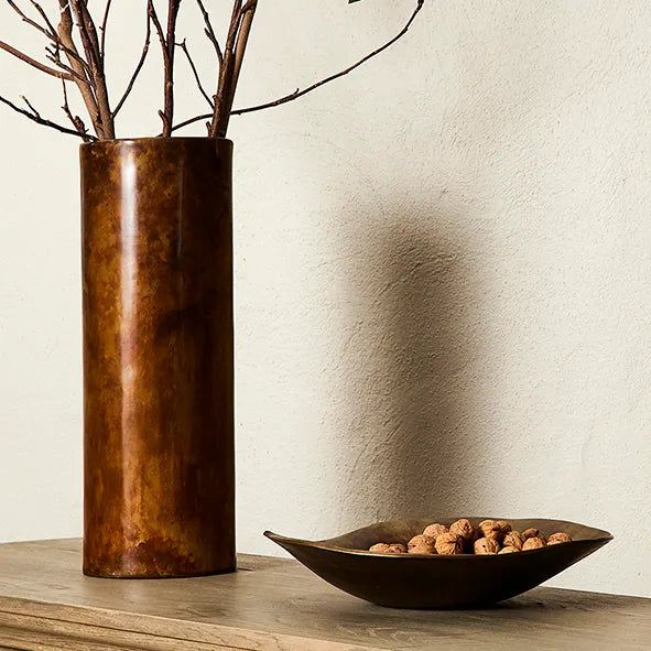 Alman Vase.  Sleek and modern column vase in murky copper finish. Use to display large branches, or long stem flowers. 