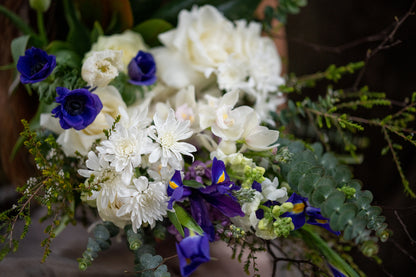 Close up of Unconditional Love bouquet pictured in Blue and White hues.