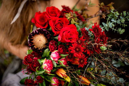 Close up of Unconditional Love bouquet pictured in Red tones.